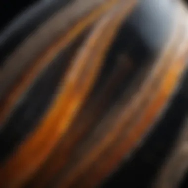 A close-up view of a polished onyx gemstone showcasing its unique banding patterns and rich colors.